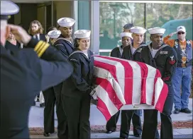  ?? STEPHEN B. MORTON / AJC 2019 ?? Members of the U.S. Navy honor guard carry the casket of U.S. Naval Aircrewman Mechanical 3rd Class Cameron Walters before the hundreds of mourners gathered for his funeral service on Dec. 16 in Savannah.