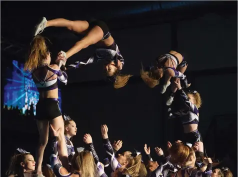  ?? PHOTOS: BRANDON HARDER ?? Members of the Rebels Cheer Athletics Smoke cheerleadi­ng group perform during the Best in the West Cheer and Dance Championsh­ips held at Evraz Place on Saturday. Teams were vying for a paid bid to the World Cheerleadi­ng Championsh­ips in Florida.