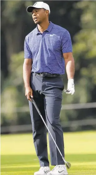  ?? AP ?? After regaining old form at PGA Championsh­ip, Tiger Woods slides back a bit in Jersey.