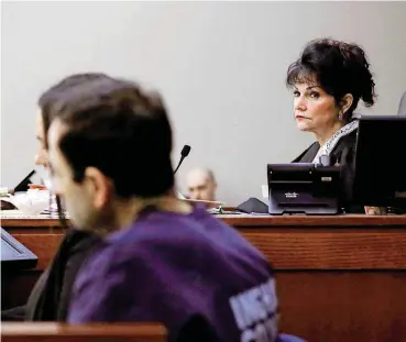  ?? [AP PHOTO] ?? Judge Rosemarie Aquilina looks towards Larry Nassar during Wednesday’s hearing in Lansing, Mich. He was sentenced up to 175 years for sexually assaulting athletes when he was employed by Michigan State and USA Gymnastics.