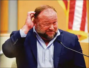  ?? Tyler Sizemore / Hearst Connecticu­t Media file photo ?? Infowars founder Alex Jones takes the witness stand to testify at the Sandy Hook defamation damages trial at state Superior Court in Waterbury in September.