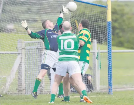  ??  ?? Liscarroll's Sean Healy punches a first half goal past Ballycloug­h goalkeeper Edmond O'Connor as the sides met in the North Cork Junior A Football Championsh­ip last weekend. Photo by Eric Barry