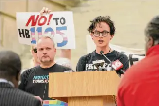  ?? Rogelio V. Solis/Associated Press ?? Cole-Finley Nelson, right, speaks at a protest of Mississipp­i House Bill 1125, which bans gender-affirming care for trans children.