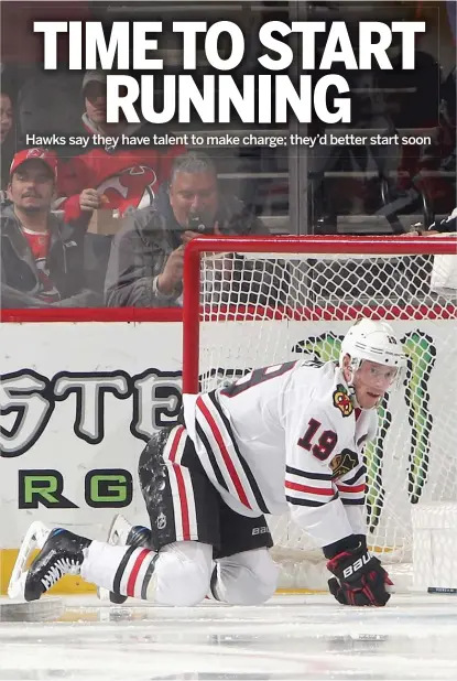  ?? BRUCE BENNETT/GETTY IMAGES ?? Jonathan Toews and the Blackhawks enjoyed some levity after an 8-5 loss to the Devils on Monday.