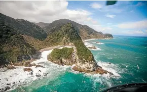  ?? PHOTOS: LIZ CARLSON ?? Flying into Martins Bay takes you past some of the most stunning Fiordland coastline.