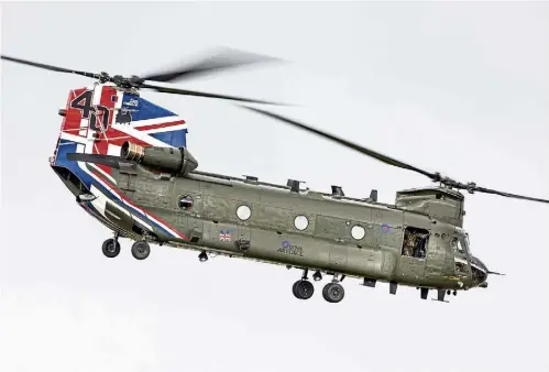  ?? ?? STALWART: A 27 Squadron Chinook operating out of RAF Odiham sporting a paint scheme for the helicopter’s 40th anniversar­y.