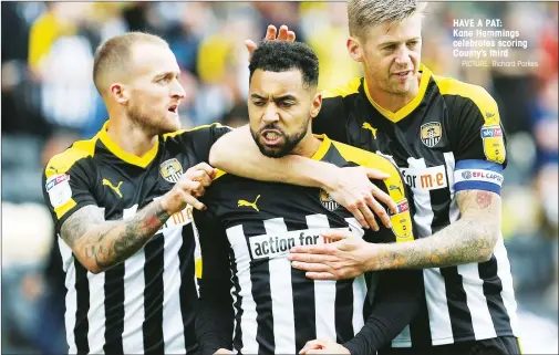  ?? PICTURE: Richard Parkes ?? HAVE A PAT: Kane Hemmings celebrates scoring County’s third