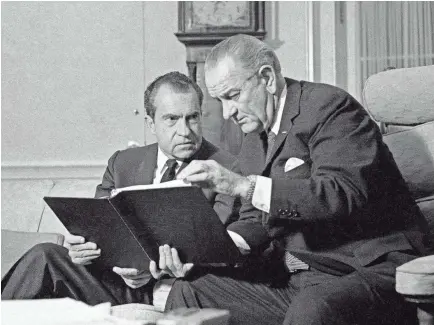  ?? 1968 AP PHOTO ?? President Lyndon Johnson, right, confers with President-elect Richard Nixon in the White House in Washington, D.C.