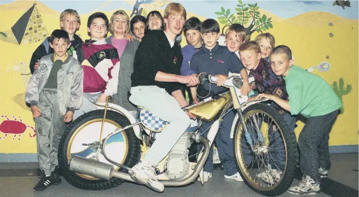  ??  ?? Youngsters from the Catholic Youth Club with speedway driver Richard Juul in June 1993.