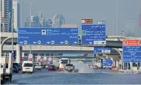  ?? Cacace/AFP/Getty Images ?? Cars on a still-flooded stretch of motorway in Dubai last Saturday Photograph: Giuseppe