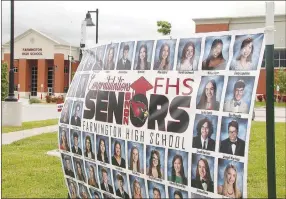  ?? LYNN KUTTER ENTERPRISE-LEADER ?? Senior moms have placed signs in front of Farmington High School to celebrate the Class of 2020. A tentative graduation date is set for 10 a.m. Friday, July 24, at Cardinal Stadium.