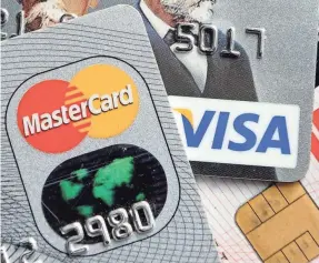  ??  ?? Credit-card debt hit a record $1.02 trillion in November. MARTIN MEISSNER/AP