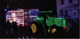  ?? PAUL POST — DIGITAL FIRST MEDIA ?? A haywagon was decorated with red, white and blue lights in the form of the American flag.