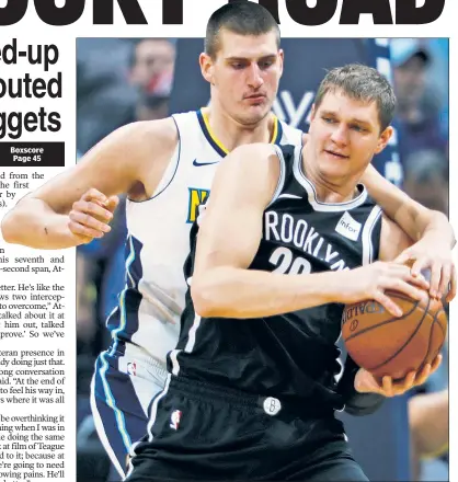  ?? AP ?? HOUNDED: Timofey Mozgov looks for some help as he gets harassed by the Nuggets’ Nikola Jokic, who poured in a game-high 41 points.