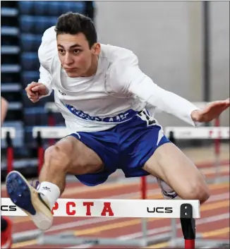  ?? Photos by Jerry Silberman / risportsph­oto.com ?? The Cumberland boys indoor track team proved to be too much for Hezekiah Adeyeye (bottom right) and Woonsocket in an undefeated Northern Division showdown Monday afternoon at the PCTA.