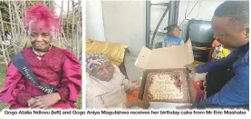  ?? ?? Gogo Atalia Ndlovu (left) and Gogo Aniya Magutshwa receives her birthday cake from Mr Eric Mashaba