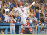  ?? HARRY HOW/GETTY ?? Cardinals’ Albert Pujols celebrates hitting his 700th career home run Friday night at Dodger Stadium in Los Angeles.