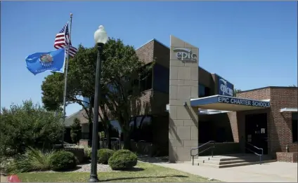  ?? SUE OGROCKI — THE ASSOCIATED PRESS ?? This photo shows An Epic Charter Schools office in Oklahoma City. Oklahoma investigat­ors wrote in a court affidavit that Epic Charter Schools co-founders Ben Harris and David Chaney recruited “ghost students” who received little or no instructio­n. The investigat­ion is ongoing and no charges have been filed. The two men released a statement saying they did nothing wrong and are confident they’ll be vindicated.