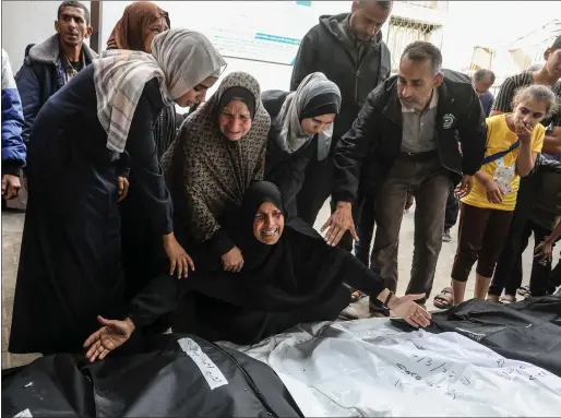  ?? ?? The latest victims of Israeli air strikes included a husband, his pregnant wife and their three-yearold child. Doctors managed to save the unborn baby Picture: Abed Rahim Khatib/anadolu via Getty Images