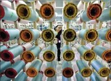  ?? LU QIJIAN / FOR CHINA DAILY ?? An employee works on the production line of a textile plant in Fuyang, Anhui province.