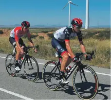  ??  ?? UAE Team Emirates rider, right, Sven Bystrom ahead of Jelle Wallays who would eventually win Stage 18 of the Vuelta AFP