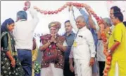  ?? PTI ?? PM Narendra Modi is garlanded at an event in Kutch, Gujarat, on Monday. The PM said Kandla Port Trust should be named after BJPRSS ideologue Deendayal Upadhyaya.