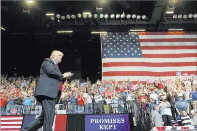  ?? Susan Walsh ?? The Associated Press President Donald Trump on Wednesday visited Cedar Rapids, Iowa, for a campaign rally, where he hailed former Iowa Gov. Terry Branstad, now the U.S. ambassador to China.