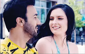  ?? Special to The Daily Courier ?? A screenshot from a Punjabi music video in which Osoyoos model Ittia Edwards starred with singer Gurvinder Brar. The scene pictured was shot in downtown Penticton, and the video had been viewed one million times on YouTube as of Wednesday.
