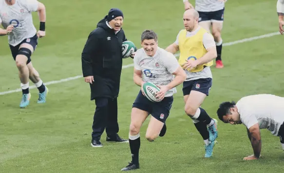  ??  ?? England head coach Eddie Jones encourages the players during the warm up before the Guinness Six Nations match at the Aviva Stadium.