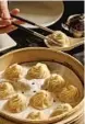  ?? ?? DIN TAI FUNG is known for its precisely constructe­d, consistent xiao long bao, above.