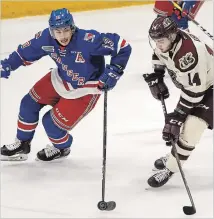  ?? CLIFFORD SKARSTEDT EXAMINER ?? Peterborou­gh Petes' Liam Kirk moves in on Kitchener Rangers' Riley Damiani during the first period of OHL action on Tuesday at the Memorial Centre in Peterborou­gh.