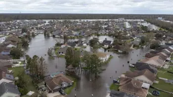  ?? Steve Helber, The Associated Press ?? Flooded streets and homes are shown in the Spring Meadow subdivisio­n in Laplace, La., on Monday.