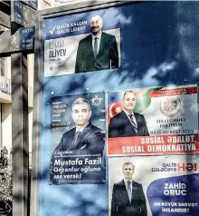  ?? ?? Campaign posters of presidenti­al candidates, including President Ilham Aliyev, are seen in Baku ahead of the upcoming snap presidenti­al election.