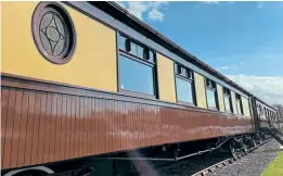  ?? RER ?? The two standard gauge Pullman camping coaches next to the 15in gauge line at Ravenglass.