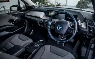  ??  ?? DRIVER: Terence Steenkamp Terence_carmag above This Atelier interior design package, which favours grey and blue hues, is standard, while there are three optional ones costing up to R43 300. Note the chunky gearlever on the steering column.