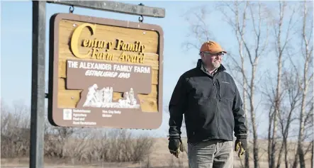  ?? QC PHOTO BY TROY FLEECE ?? Grant Alexander stands at the entrance to Horseshoe Creek Farms near Weyburn.