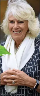 ??  ?? NATURAL HEALTH: Camilla wearing her Fitbit activity watch last week
