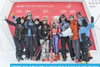  ??  ?? COURCHEVEL: Winner US Mikaela Shiffrin (C) celebrates with the US ski team on the podium after winning the FIS Alpine Women’s World Cup Giant Slalom yesterday in Courchevel, French Alps.— AFP