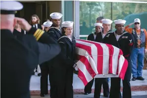 ?? Stephen B. Morton/Atlanta Journal-Constituti­on via AP ?? ■ Members of a U.S. Navy honor guard carry the casket of U.S. Navy Airmen Apprentice Cameron Walters after his funeral service Monday in Savannah, Ga.