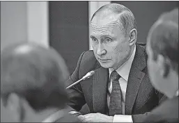  ?? [ALEXEI NIKOLSKY, KREMLIN POOL PHOTO] ?? Russian President Vladimir Putin approved the retaliator­y measures against U.S. sanctions despite having said he might wait until the sanctions became law.