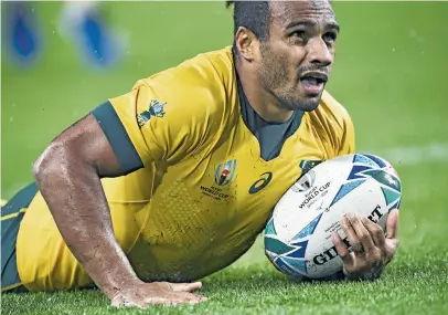  ?? Picture: AFP ?? FIVE-POINTER. Wallaby scrumhalf Will Genia goes over for a try during their Rugby World Cup Pool D match against Georgia at the Shizuoka Stadium Ecopa yesterday.