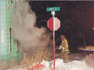  ?? SUBMITTED PHOTO ?? Firefighte­rs are shown on scene at a Monday night fire in Whitney Pier where a man was found dead. The death is under investigat­ion.