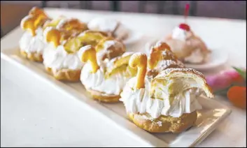  ?? Siena Italian Trattoria ?? Siena Italian Trattoria’s brunch features baked goods including cream puff swans.