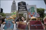  ?? THE ASSOCIATED PRESS ?? Protesters gather to demonstrat­e against President Donald Trump’s immigratio­n policies during the Families Belong Together - Freedom for Immigrants March in downtown Los Angeles on Saturday.