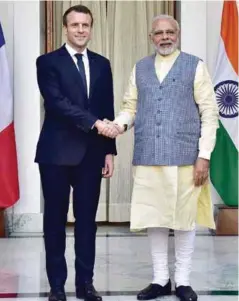  ??  ?? RE-ENERGISING TIES: PRIME MINISTER NARENDRA MODI WITH PRESIDENT OF THE FRENCH REPUBLIC EMMANUEL MACRON IN NEW DELHI