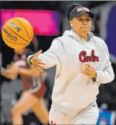  ?? Morry Gash The Associated Press ?? South Carolina coach Dawn Staley runs a drill during a practice ahead of the Final Four semifinal against N.C. State in Cleveland on Friday.