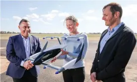  ??  ?? NSW deputy premier John Barilaro with AMSL Aero co-founders Siobhan Lyndon and Andrew Moore and a model of the electric aircraft they say will be an ‘affordable and environmen­tally friendly transport option’. Photograph: Salty Dingo