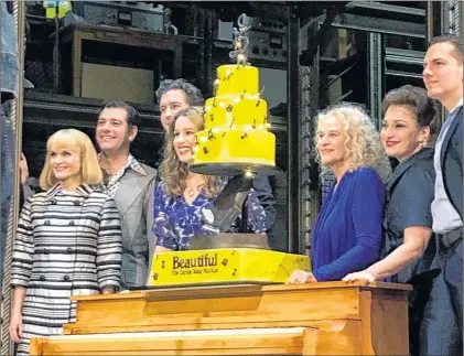  ?? AP PHOTO ?? Carole King, third from right, poses for photos with the cast of “Beautiful: The Carole King Musical” at the Stephen Sondheim Theatre after a performanc­e in New York on Saturday.