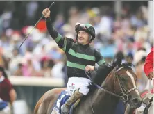  ?? ROB CARR/GETTY IMAGES ?? Jockey Brian J. Hernandez Jr. celebrates atop of Mystik Dan after winning the 150th Kentucky Derby last weekend.