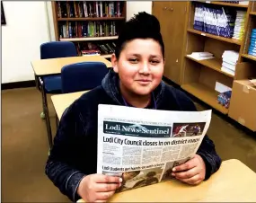  ?? COURTESY PHOTOGRAPH ?? Lodi Middle School student Victor Angel Rosales listens to a presentati­on from Lodi NewsSentin­el Editor Scott Howell on career day.